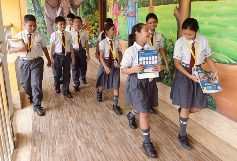 Pupils walking along the school corridor