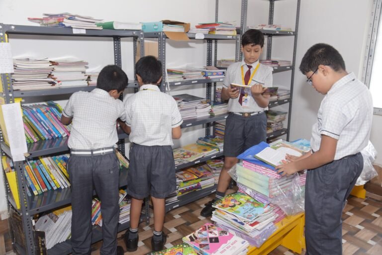 Pupils browsing the shelves in the school library