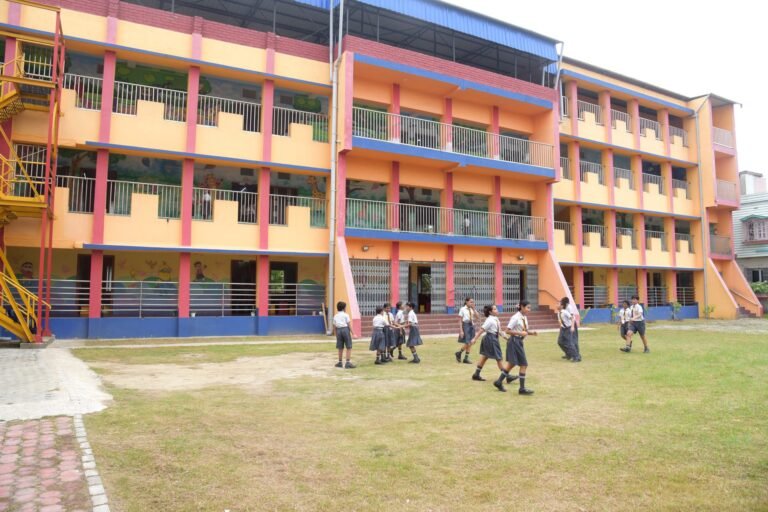 Main building of St. Xavier's Public School, Haldia, with children playing on the lawn