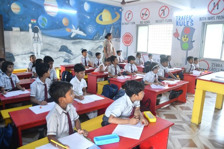 Primary pupils in a classroom with their teacher
