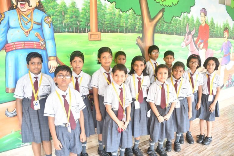 Group of pupils in front of a corridor mural